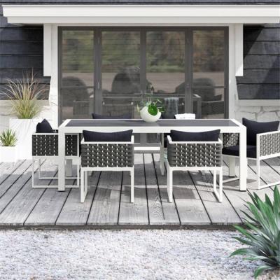 China Waterproof 7 Piece Garden Wicker Outdoor Dining Sets Rectangular Rattan Tables And Chairs Furniture With Cushions for sale