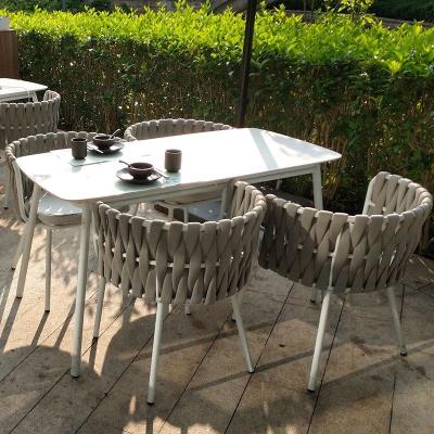 China Luxury outdoor dining table and chair woven waterproof modern indoor and outdoor dining room furniture for sale