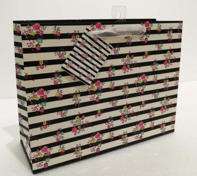 China Low Cost Recyclable Ribbon Handle Gift Carrier Bag With Custom Design Logo Print for sale