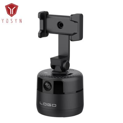 China Adjustable 2 in 1 360 Rotation Tripod Stand Cell Phone Selfie Stick Face 600mAh Battery Object Auto Tracking Phone Holder for Live Stream for sale