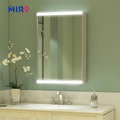 China Modern Hotel Smart Mirror Magnifying Wall Hung Bathroom Led Mirror Bathroom Fogproof Cabinet for sale