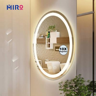 China Custom Oval Wall Mounted Bathroom Magnifying Explosion Proof Glass Mirror With Led Lights for sale