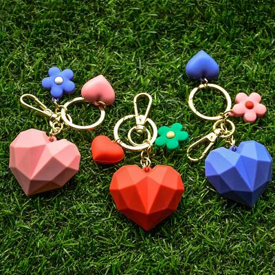 China Fashionable Geometric Heart Section Fishing Buckle Leather Car Hanging Bag PVC Doll Gift Key Chain Key Chain for sale