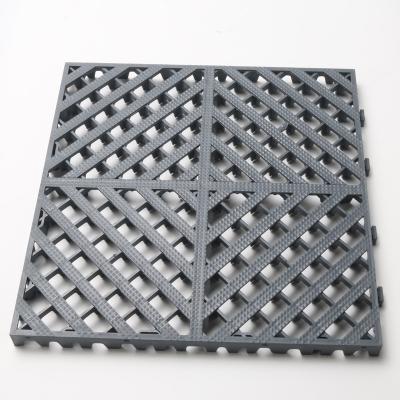 China PP Material Garage Event Flooring Durable Non Slip Durable Plastic Elastic Flooring Splice Tile Flooring Te koop