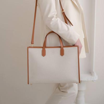 China PORTABLE 2022 new fashion large capacity women's and men's plain tote bag wholesales custom logo women's canvas leather bags ladies handbags for sale