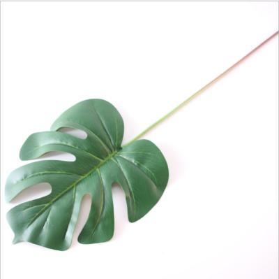 China Natural Touch Monstera Leaves Hot Sale Artificial Plastic Monstera Leaves Wedding Party Home Decoration for sale