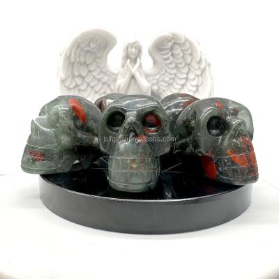 China Europe Best Selling Energy Gemstone Crafts Christmas Gift African Blood Stone Crystal Skulls for sale