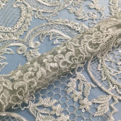 China Viable Lace Embellished Embroidery Gupiure Tulle Beaded Pearl Lace Fabric With Stone for sale