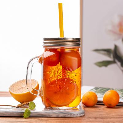 China Wholesale Luxury Custom Stocked GROCERY 490ml 16.6oz Flower Pattern Mason Glass Jar Round Lids With Handle for sale