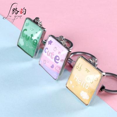 China Key Chain Mold Custom 3*10cm Double Sided Creative Souvenir Key Chain Colorful Words Adjust Glass Key Chain for sale