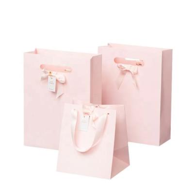 China Renewable Recyclable Cheap Freight Manufactures Personalized Pink Cake Shopping Paper Bags for sale