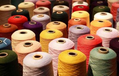 China Colorful TFO 40/2 Plastic Core Dyed Polyester Yarn / Thread For Sewing Machine for sale