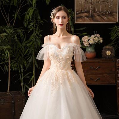 China Spaghetti Design White Lace Breathable Elegant Bridal Ball Gown Wedding Dress for sale