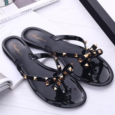 China Flat Cheap Clear Beach Shoes Non Slip PVC Sandals For Women for sale