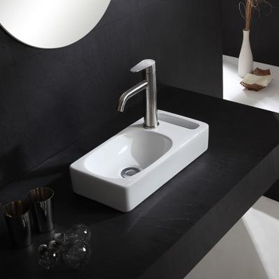 China HY-3086 Modern Small Bathroom Ceramic Wash Basin Hand Basin With Towel Rack for sale