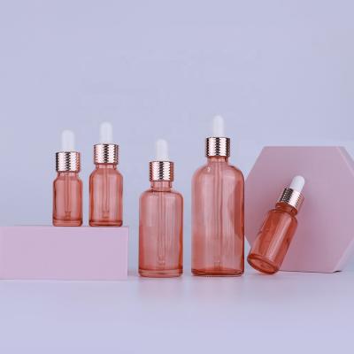 China Personal Care Fancy Rose Gold 30ml Dropper Packaging Glass Cosmetic Bottle With Honeycomb Ring Dropper for sale