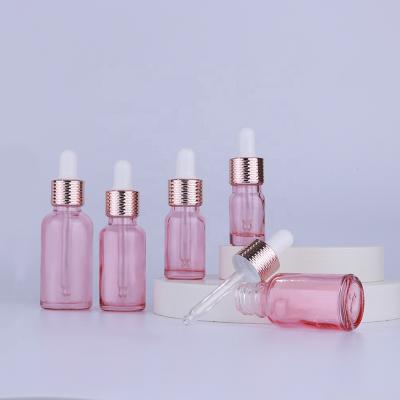 China Empty Rose Gold 10ml 20ml 30ml 50ml Round Personal Care Glass Dropper Bottle With Honeycomb Ring Dropper for sale