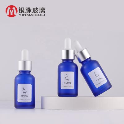 China Custom Personal Care Cosmetic Packaging Hair Oil Essential Oil Dropper Blue Clear Glass Bottle 30ml for sale