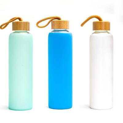 China Sustainable Eco Friendly Bamboo Lid Glass Water Bottle With Silicone Protective Sleeve for sale