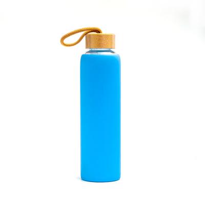 China Bpa Silicone Sleeve Borosilicate Glass Sustainable Free Water Bottle With Portable Strap for sale