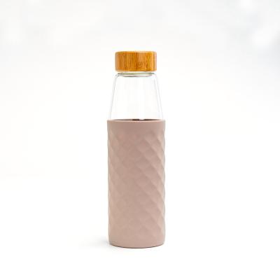 China New Design Sustainable Lid Bamboo Silicone Sleeve Glass Water Bottles For Drinking for sale