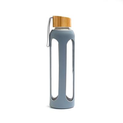 China Custom Sustainable Reusable Eco Friendly Silicone Sleeve Glass Water Bottle With Bamboo Lid for sale