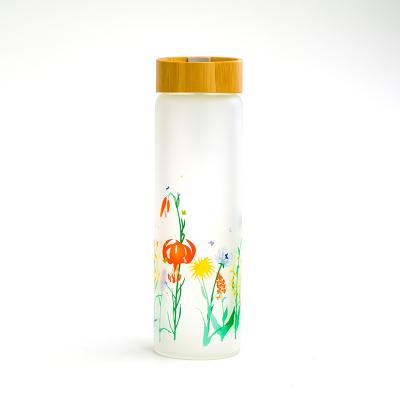 China Customized Sustainable Printing Frosted Glass Water Bottle With Bamboo Lid for sale