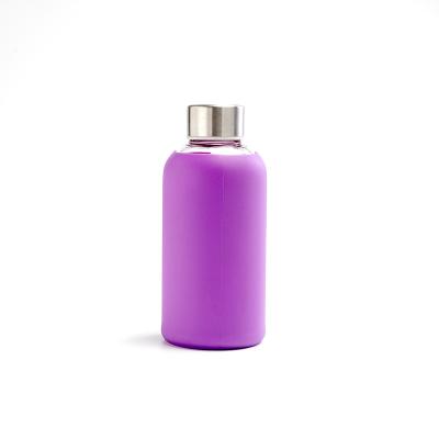 China Hot Selling Sustainable Milk Glass Bottle 17oz Water Bottles With Silicone Sleeve for sale