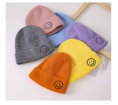 China COMMON New Design Custom Cotton Baby Candy Colors Smiley Face Beanies Kids Knitted Hats Cute Winter Beanie for sale