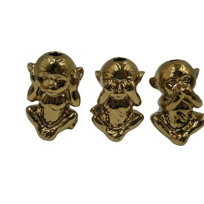 China Europe imitated monkey design ceramic bookends with brass base, antique bronze book holder with porcelain animal statues for sale