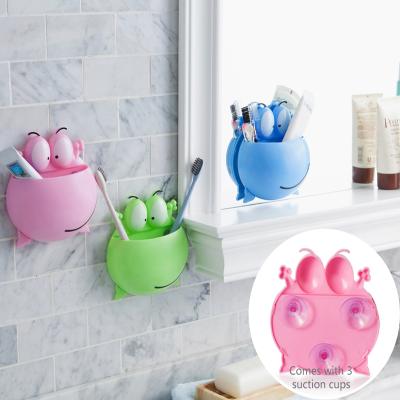 China Children Cute Colorful Cartoon Frog Suction Wall Toothbrush Holder Wall Mounted Animal Toothbrush Holder for sale