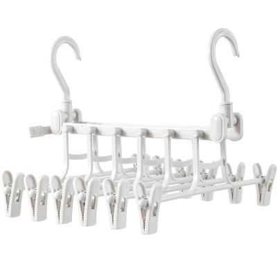 China New Eco-friendly Multifunctional Plastic Pants Racks 6 In 1 Time Clothes Drying Clip Telescopic Magic Hanger Pants Racks With Hook Clips for sale