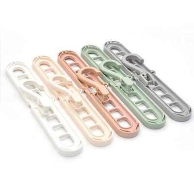 China 9 Multi-Function Magic Clothes Hanger Revolving Magic Cloth Hook Clip Hanger Eco-Friendly New Products Revolving Hardware Plastic Hangers For Clothes 12 Packs for sale