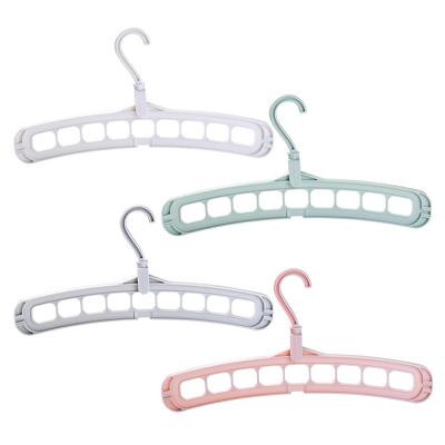 China 9 Hole 360 ​​Rotating Clip Magic Folding Plastic Scarf Hanger Eco-friendly Factory Direct Material Multifunctional Bra Hangers for sale