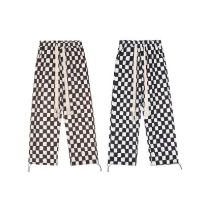 China Flat 2022 chinese manufacturer new loose trend teenagers couples pants commercial retro plaid men for sale