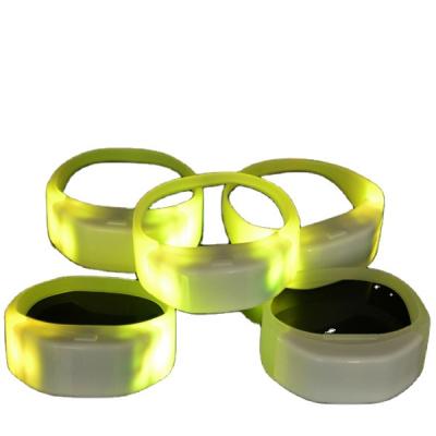 China Flash Light RGB Concert RFID Tap Radio (0603 /0805 Led Lights) Controlled LED Wristband for sale