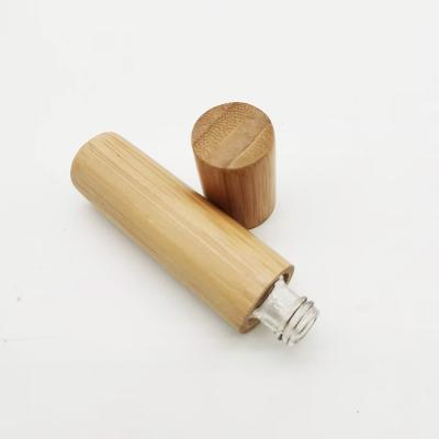 China Nature 5ml 10ml Empty Bamboo Lid Top Selling Glass Inner Roll On Oil Fragrance Bottles Wooden for sale