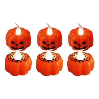 China Colorful Light Face Tealight Flameless Pumpkin Tea Light Candles 12 Battery Operated Flickering Electric Led Tealight Candles for sale