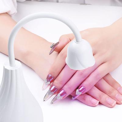 China PC+ABS Portable Rechargeable Quick-Drying Nail Lamp Desk Lamp Gel UV/LED Nail Phototherapy Lamp Pink for sale