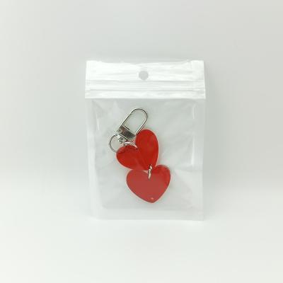 China Simple heart shaped acrylic key chain made of colorful transparent acrylic for sale