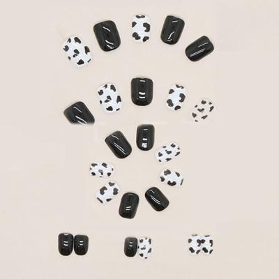 China Wearing Fashionable White Nail Art Girls' Nail Patches 24 Pattern Color Combination Glue White Black Self Adhesive Wearable Short Cowhide Nails for sale