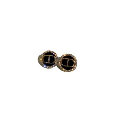 China Trendy Korean Luxury Copper Zircon Stud Letter Gold Needle Mail Fashion Charm Single Stud Earrings For Women for sale