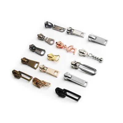 China Cheap Automatic Painted Custom Metal Zipper Puller Bags Shoes Nickel Free Zipper Pull for sale