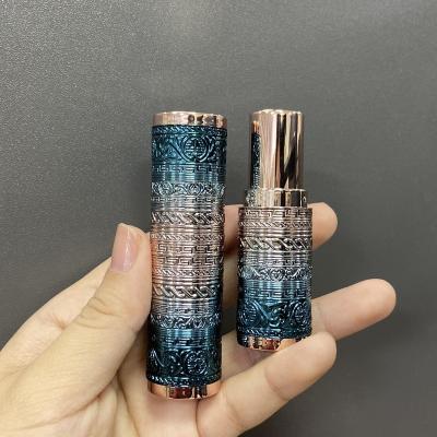 China Round lipstick tube with delicate cutting pattern in stock low moq luxury new lipstick tube packaging with cutting out decorative pattern new design heavy weight for sale