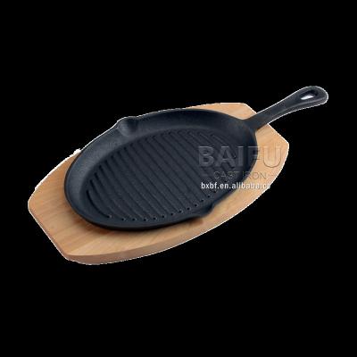 China Sustainable Cast Iron Sizzling Pan Fajita Pans Non-Stick Sizzling Dish With Wooden Base for sale