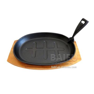 China Sustainable Cast Iron Sizzling Pan Fajita Pans Non-Stick Sizzling Dish With Wooden Base for sale