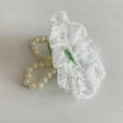 China Wedding Supplies Bride Handcrafted Wedding Flower Wedding Wrist Flowers Champagne Satin Bow Pearl Wrist Flower Corsage for sale