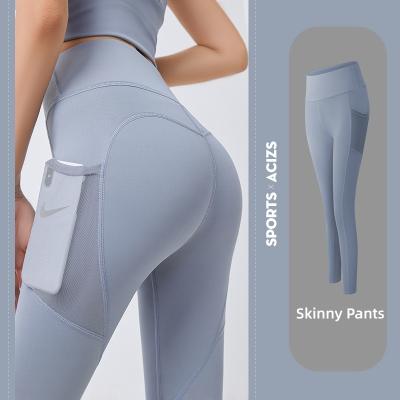 China New Designs Workout Sportswear Stretch High-waisted Pocket Breathable Side Buttocks Sweatpants Yoga Lifting Pants for sale