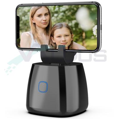 China 2021 Rechargeable Smart Selfie Stick 360 Rotating Automatic Face Tracking Smart Phone Holder Camera Tripod Shooting Phone Mount for sale