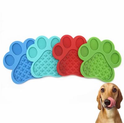 China Dog Footprint Shaped Bowl Lick Pad Pet Feeder Cat Silicone Slow Food Mat for sale